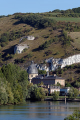 Les Andelys village and chalk cliffs in the Seine river bank