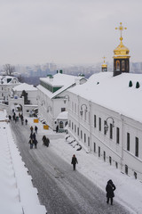 Kiev Pechersk Lavra with people in snow