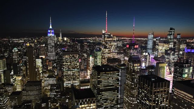 NEW YORK CITY - DECEMBER 2018: Fast Time Lapse of city skyline at night. The city attracts 50 million tourists annually