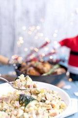 Russian salad in a large plate for a festive table. Delicious traditional food in Russia in the winter. Free text for text.