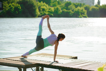 Young slim yoga woman making beautiful asana exercises. Healthy lifestyle. Stretching.