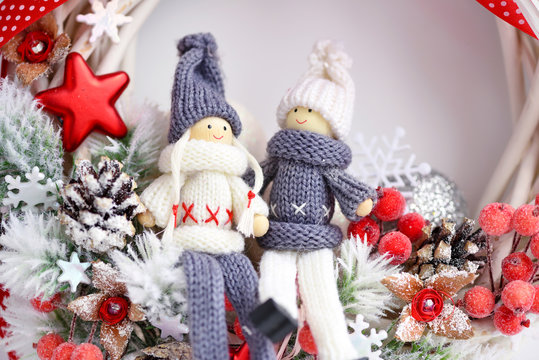 Christmas composition with toys dolls and spruce branches and festive decorations. Christmas or New Year greeting card.