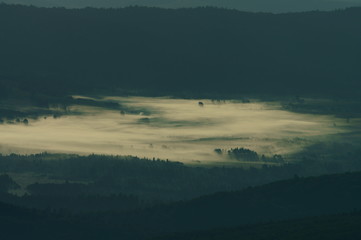 Misty sunrise in the Bieszczady Mountains. Poland
