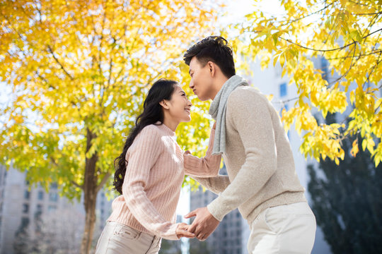 Happy young couple dating in autumn