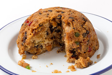 college pudding cut open on a serving dish
