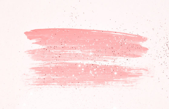 Abstract pink watercolor splash and golden glitter in vintage nostalgic colors.