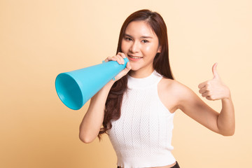 Beautiful young Asian woman show thumbs up announce with megaphone.