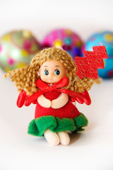 New Year's little doll fairy in a festive Christmas red dress