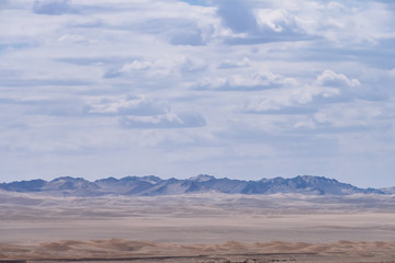 Fototapeta na wymiar Mountains over gobi desert from the historical site of Yang Pass, in Yangguan, Gansu, China