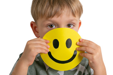 Depressed boy holding smile, pretending to be fine. Face of the depression
