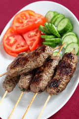 Arab lamb kofta on a plate vertical