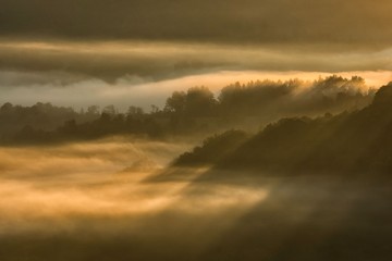 Naklejka na ściany i meble Misty sunrise in the Bieszczady Mountains. Poland