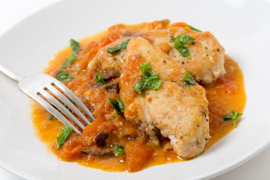 Provencal chicken breast meal with a fork