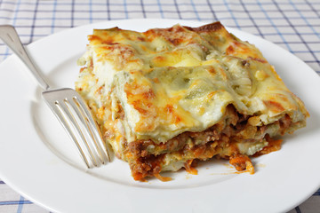Lasagne slice with fork