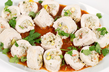 Serving dish of stuffed chicken breasts