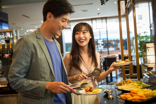 Young couples in the buffet