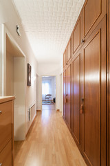 Corridor with parquet and wooden wardrobe