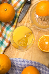 freshly squeezed orange juice with ice cubes in a glass