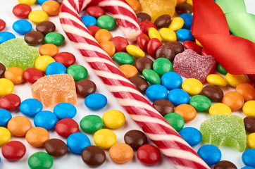 Fototapeta na wymiar Abstract pattern with round color candy on background. Colorful sweets top view. Flat lay image