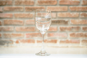 Empty Wine glasses with brick wall background