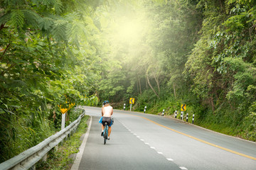 A man is riding a car on a mountain.