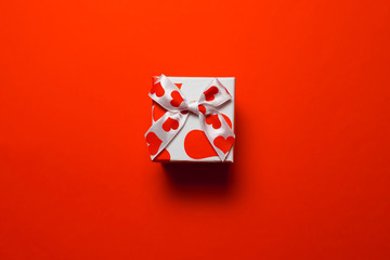 A gift for Valentine's Day on a red background.