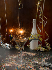 new year background with star splatter and sparkler and different new year items