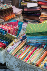  Fabric store with stacks of colorful textiles