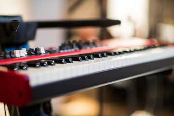 close up of red keyboard keys on stage setup