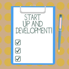 Word writing text Start Up And Development. Business concept for New business success corporate project strategy Blank Sheet of Bond Paper on Clipboard with Click Ballpoint Pen Text Space