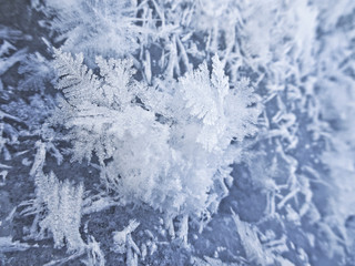 Winter mood - Snowflake crystals are lying on the ice