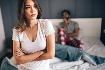 Couple having arguments and sexual problems in bed