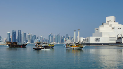 DOHA, QATAR - NOVEMBER 6, 2017: View of Doha Bay from the Corniche, with the distant business towers and the Museum of Islamic Art