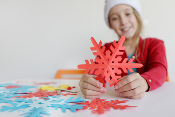  A snowflake close up in hands at the child.