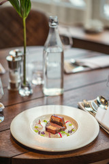 delicious apetizer with fresh vegetable served on white plate, modern michelin food