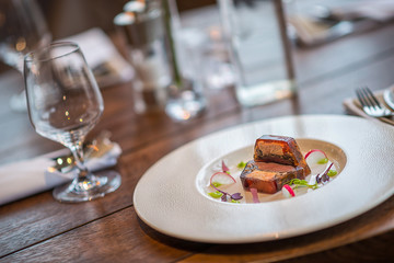 delicious apetizer with fresh vegetable served on white plate, modern michelin food