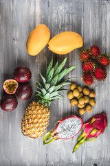 Set of exotic fruits. Assorted tropical fruits of pineapple, rambutan, passion fruit, mango, dragon fruit, longan
