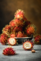 Rambutan exotic fruits from tropical countries on table. Sweet translucent flesh. Healthy food with vitamin © Artkivshar