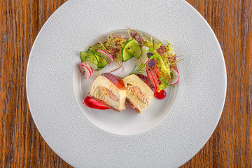 delicious apetizer with fresh vegetable served on white plate, modern michelin food