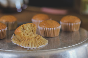 Bakery fresh banana cup cake hot from oven , home made food.