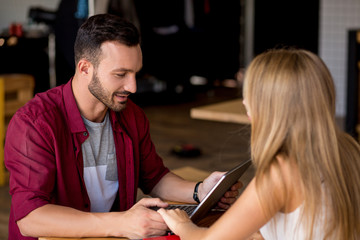 Beloved young couple in cafe