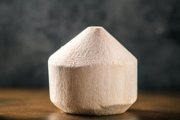 Coconut water drink on table. Exotic fruits with milk beverage. Healthy food with vitamin