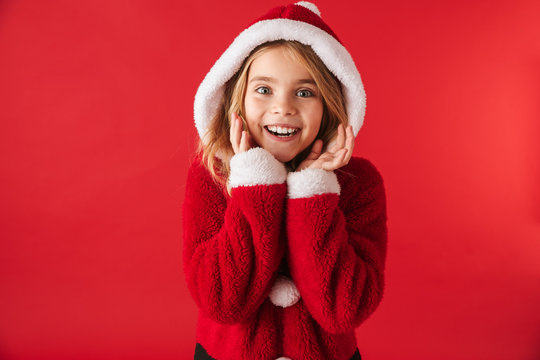 Cheerful little girl wearing Christmas costume