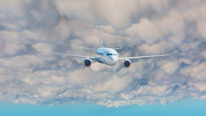Passenger Airplane flying in the stormy dramatic clouds 