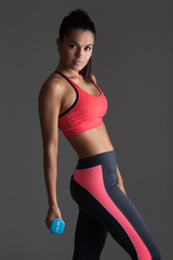 Young fitness woman whit dumbbells