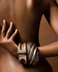 Dark Skinned Woman's Back With Hand