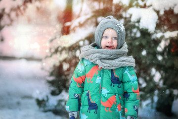 Funny baby and snowy winter