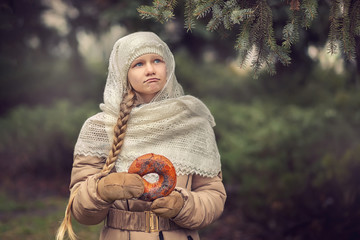 Girl with a scarf in the forest