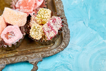 Set of various Turkish delight in bowl on metal tray