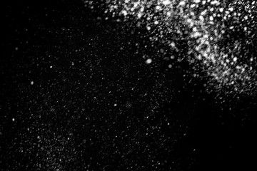 Falling snow on a black background. Snowfall weather. Texture for overlay